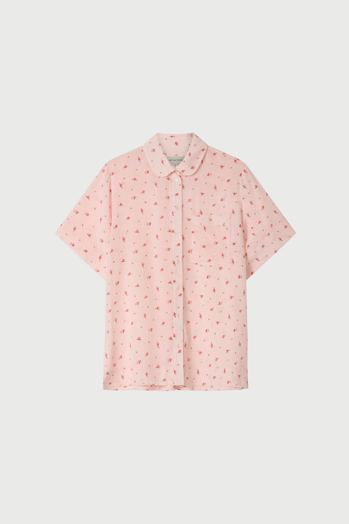 Pink floral short sleeve shirt on a white background