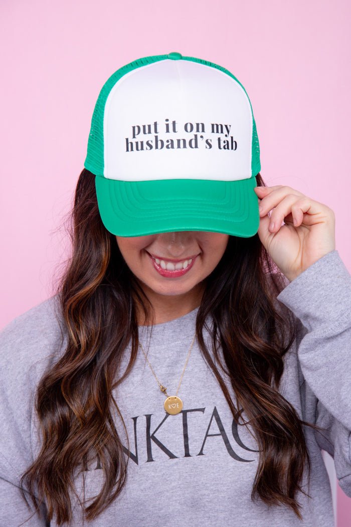 Put It On My Husband's Tab Trucker Hat