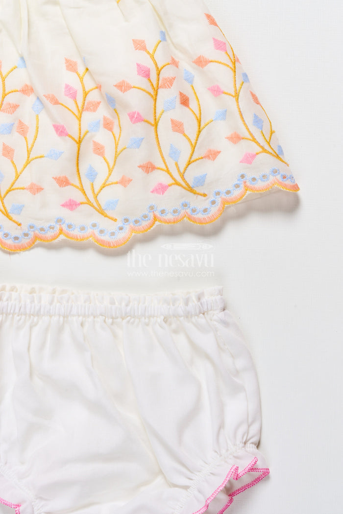 The Nesavu Baby Frocks Baby Frock with Rainbow Leaf Embroidery and Floral Patch Nesavu Nesavu cream baby frock with rainbow embroidery and floral detail