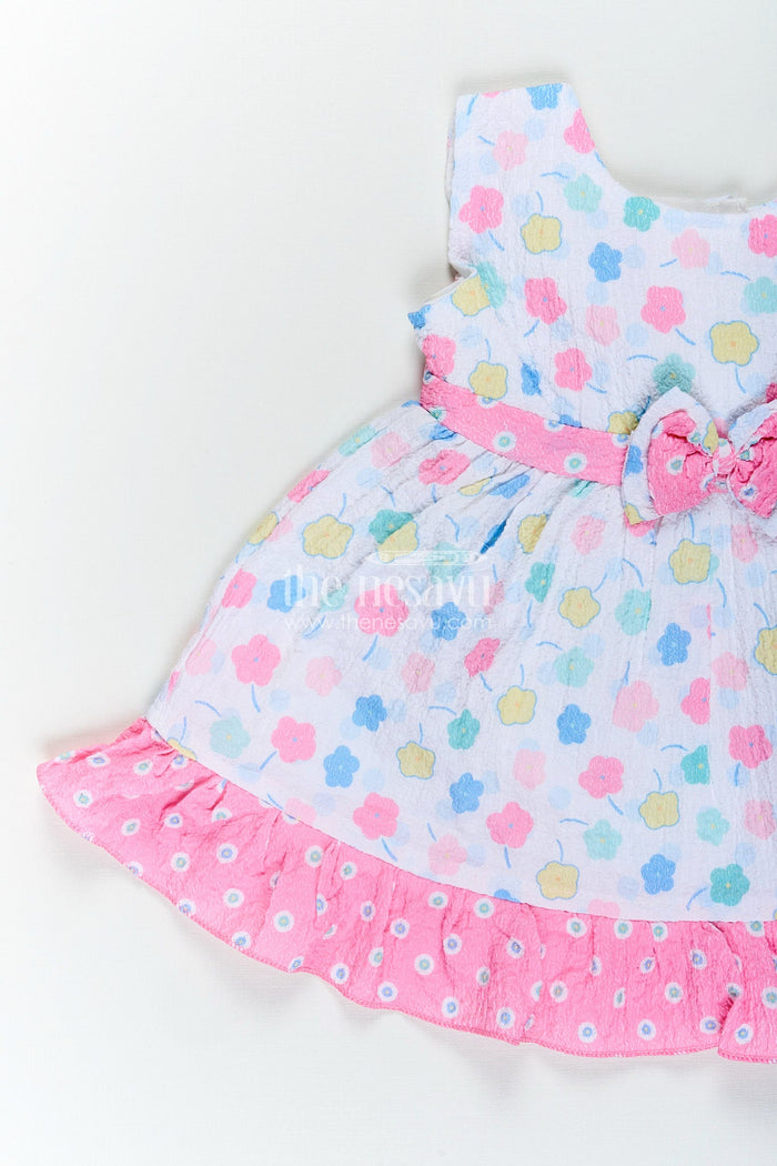 The Nesavu Baby Cotton Frocks Baby girl cotton frock with bow and floral print for casual summer days Nesavu Nesavu baby girl cotton frock pink bow floral print  perfect summer playdates daily wear