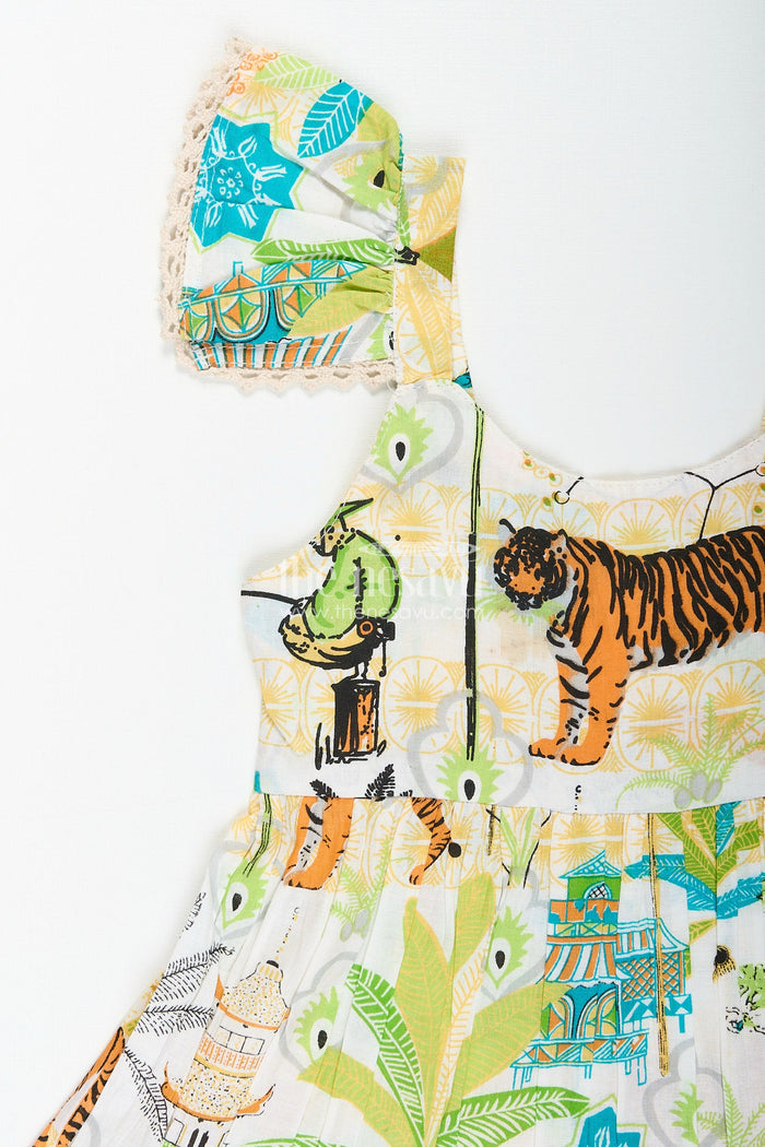 The Nesavu Baby girl frock with nature-inspired print for playful days Nesavu Nesavu baby girl frock jungle-inspired print  playful cotton outfit casual themed wear