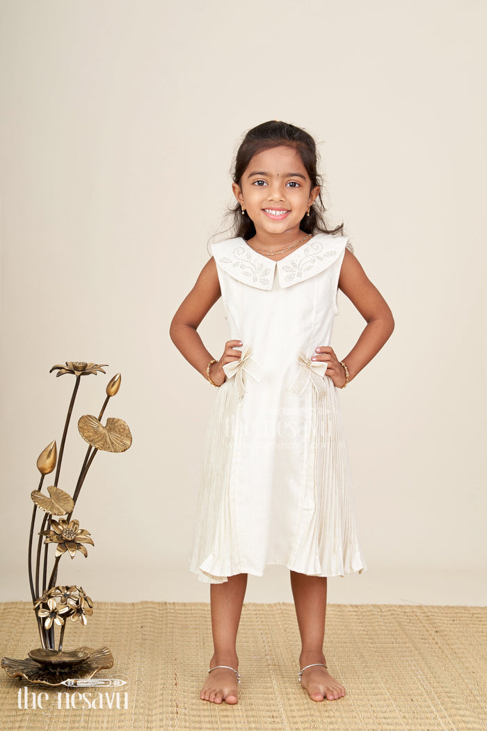 The Nesavu Girls Fancy Frock Bacchon Ki Dress Cream Girls Fancy Frock in Cotton Satin with Pleated Panels and Glitter Bow Accents Nesavu Nesavu Bacchon Ki Dress Cream Girls Frock Cotton Satin Glitter Bows Elegant Pleats