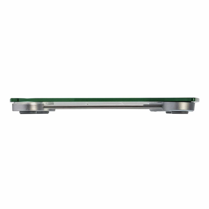 Side view of digital glass bathroom scale with green glass top and metal frame