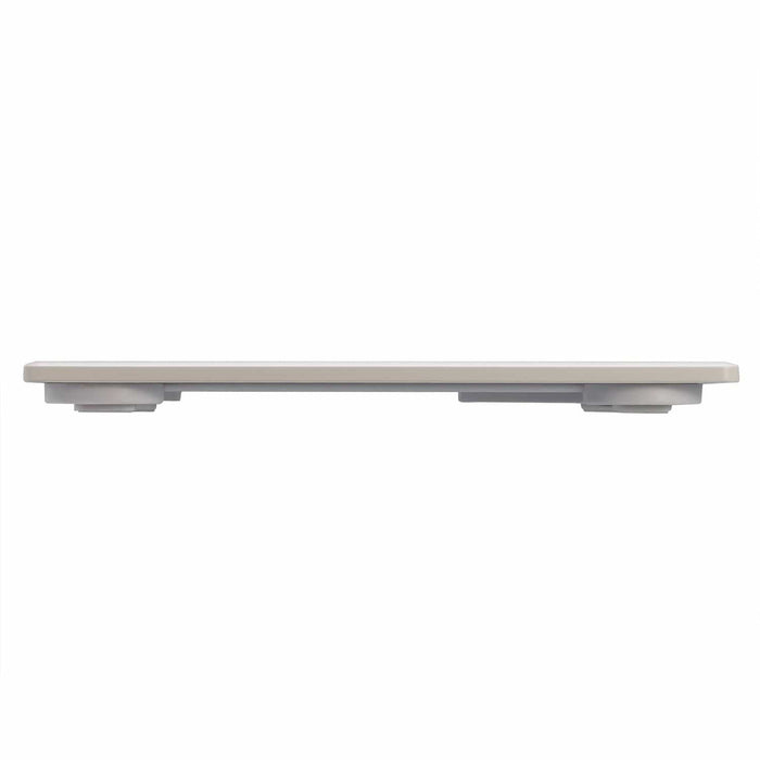 Side profile of a white digital body scale with a light beige top edge.