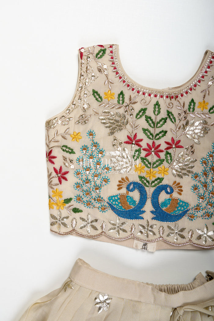 The Nesavu Girls Lehenga Choli Dress Lacha Beige Kora Silk Cotton Girls Lehenga Choli with Peacock and Deer Thread Embroidery Nesavu Nesavu Dress Lacha Girls Beige Kora Silk Cotton Lehenga Choli Peacock Embroidery Dupatta