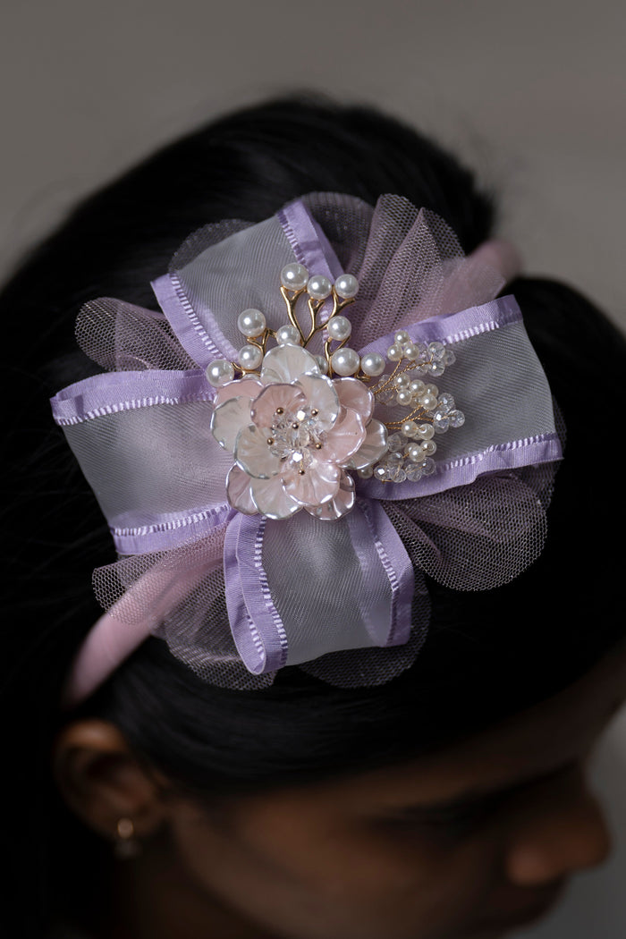 The Nesavu Hair Band Elegant Lavender Pearl Floral Hairbow with Tulle and Satin Accents Nesavu Purple JHB77B Lavender Pearl-Adorned Floral Hairbow | Hair Accessory for Special Occasions | The Nesavu
