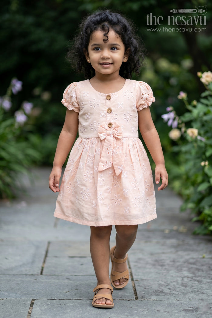 The Nesavu Girls Cotton Frock Girls Cotton Sleeveless Dress in Pastel Peach with All-Over Hakoba Floral Embroidery Nesavu 18 (2Y) / Orange GFC1714A-18 Cotton Sleeveless Dress for Girls in Peach Hakoba Fabric with Embroidery and Button Detail | The Nesavu