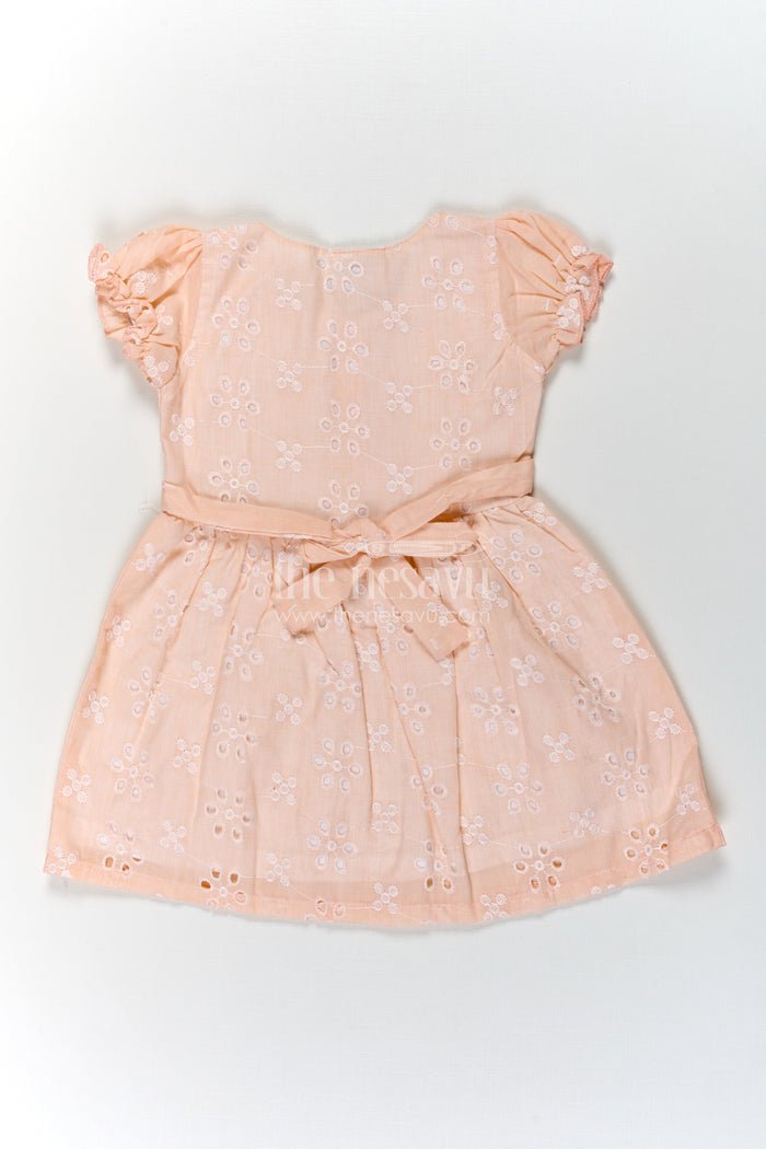 The Nesavu Girls Cotton Frock Girls Cotton Sleeveless Dress in Pastel Peach with All-Over Hakoba Floral Embroidery Nesavu Nesavu Cotton Sleeveless Dress for Girls in Peach Hakoba Fabric with Embroidery and Button Detail
