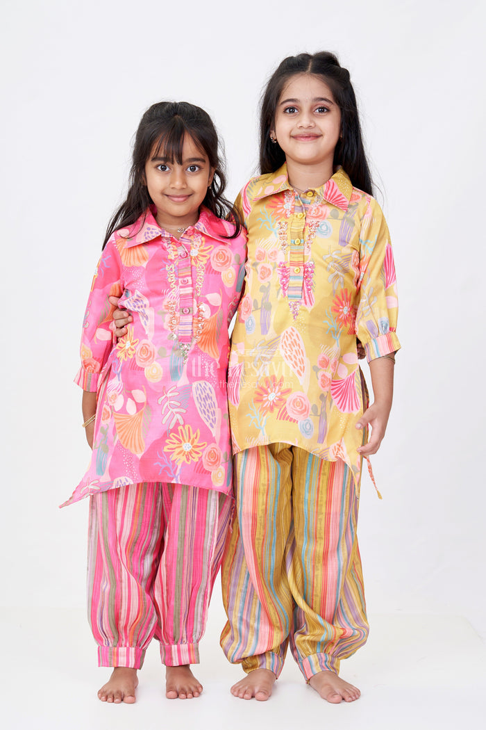 The Nesavu Girls Sharara / Plazo Set Girls Floral Co-ord Set with Bright Printed Kurti and Striped Pants in Rani Pink Nesavu Nesavu Girls Floral Co-ord Set Bright Printed Kurti Striped Pants Rani Pink