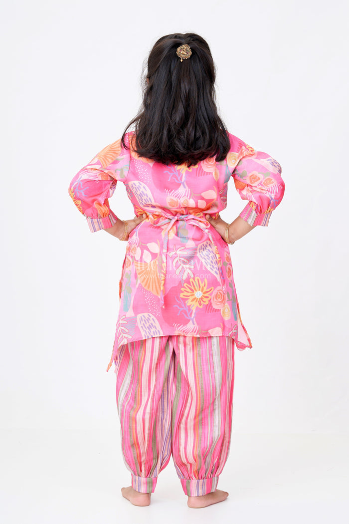 The Nesavu Girls Sharara / Plazo Set Girls Floral Co-ord Set with Bright Printed Kurti and Striped Pants in Rani Pink Nesavu Nesavu Girls Floral Co-ord Set Bright Printed Kurti Striped Pants Rani Pink