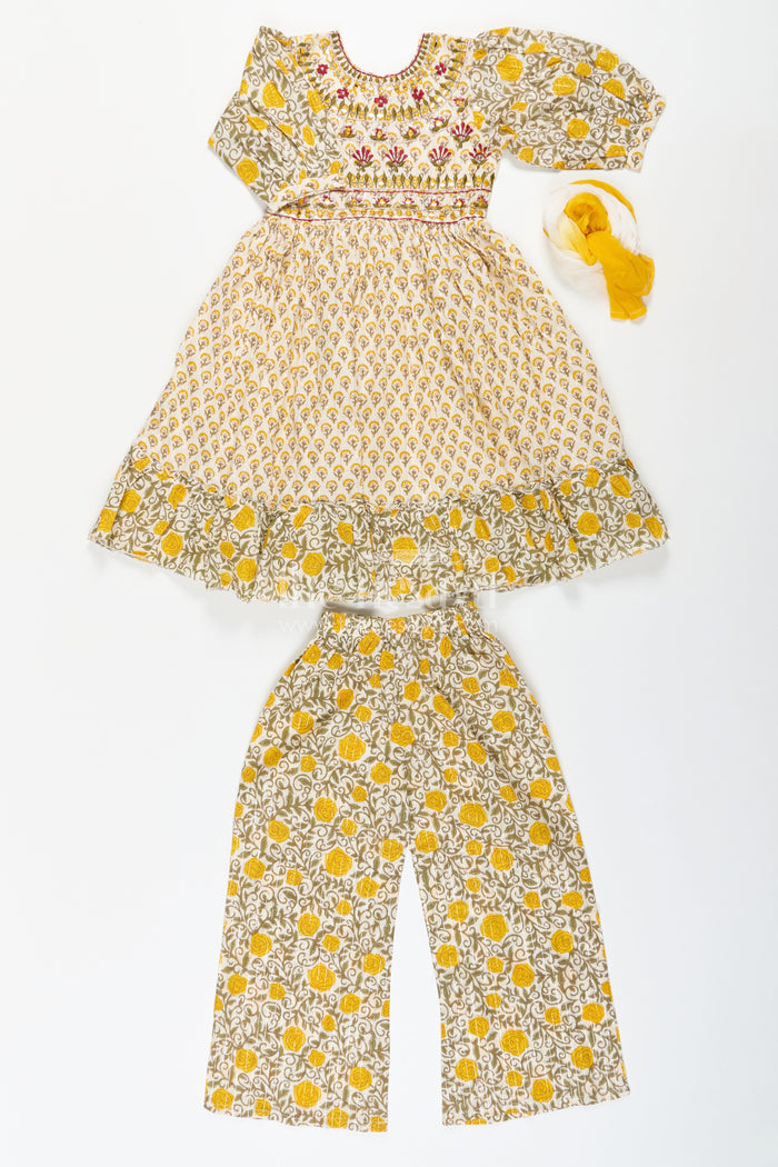 The Nesavu Girls Churidar Sets Girls Partywear Sharara Set in Yellow Floral Cotton with Mirror and Thread Embroidery Accents Nesavu Nesavu Girls Partywear Sharara Set with Mirror Embroidery and Yellow Floral Printed Cotton Co-Ord Look