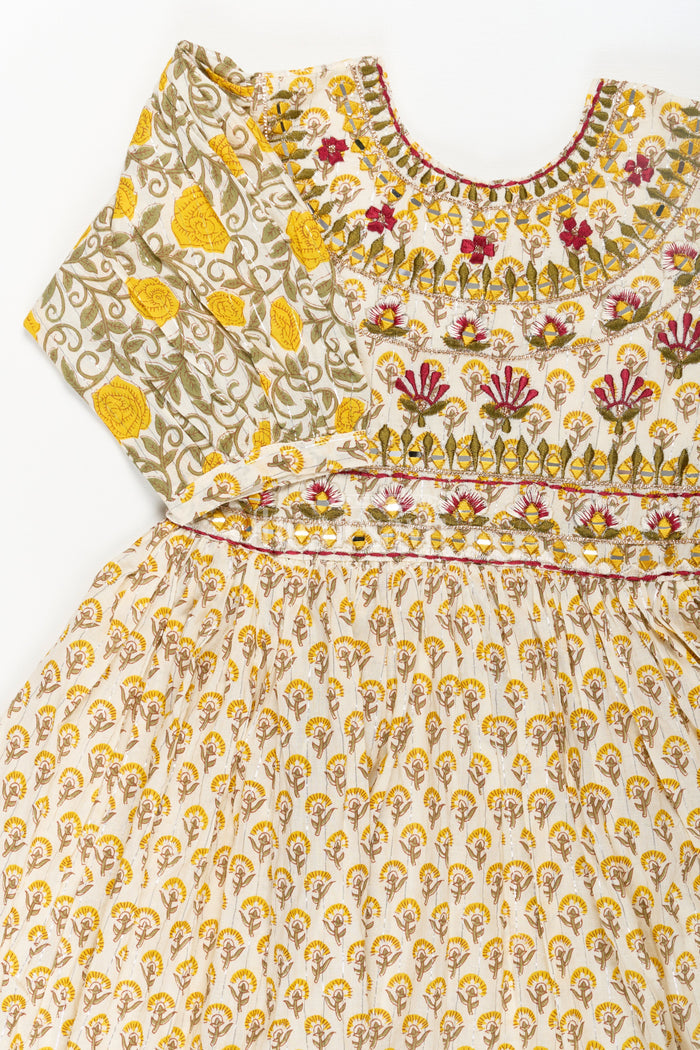 The Nesavu Girls Churidar Sets Girls Partywear Sharara Set in Yellow Floral Cotton with Mirror and Thread Embroidery Accents Nesavu Nesavu Girls Partywear Sharara Set with Mirror Embroidery and Yellow Floral Printed Cotton Co-Ord Look