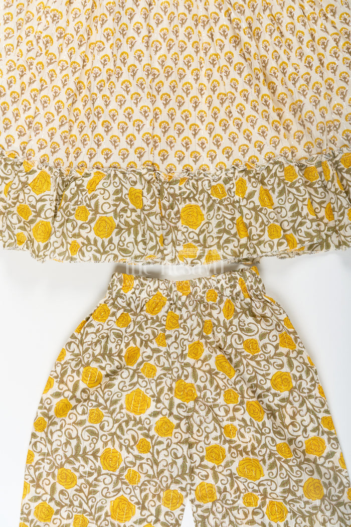 The Nesavu Girls Churidar Sets Girls Partywear Sharara Set in Yellow Floral Cotton with Mirror and Thread Embroidery Accents Nesavu Nesavu Girls Partywear Sharara Set with Mirror Embroidery and Yellow Floral Printed Cotton Co-Ord Look