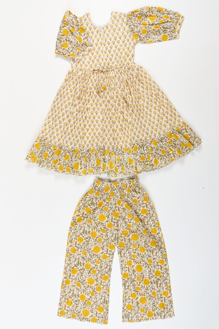 The Nesavu Girls Churidar Sets Girls Partywear Sharara Set in Yellow Floral Cotton with Mirror and Thread Embroidery Accents Nesavu Nesavu Girls Partywear Sharara Set with Mirror Embroidery and Yellow Floral Printed Cotton Co-Ord Look
