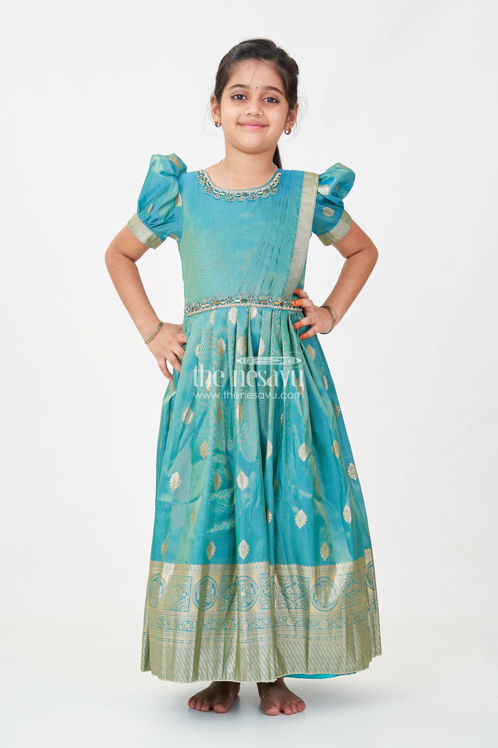 The Nesavu Girls Silk Gown Girls Pattu Gown in Banarasi Silk Blend Jacquard with Zari Big Border and Puff Sleeves for Festive Flair Nesavu Nesavu Traditional Girls Pattu Gown in Banarasi Silk Blend Jacquard with Zari Border and Puff Sleeves
