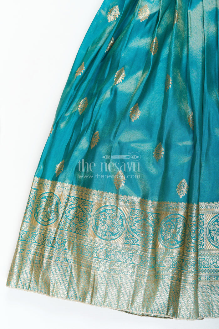 The Nesavu Girls Silk Gown Girls Pattu Gown in Banarasi Silk Blend Jacquard with Zari Big Border and Puff Sleeves for Festive Flair Nesavu Nesavu Traditional Girls Pattu Gown in Banarasi Silk Blend Jacquard with Zari Border and Puff Sleeves