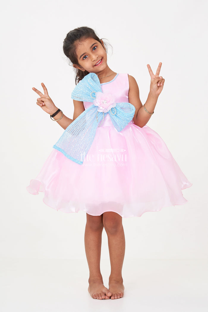 The Nesavu Girls Fancy Party Frock Girls Pink Net Frock with Blue Glitter Bow and Floral Accent in Glazed Organza Fabric Nesavu 16 (1Y) / Pink PF209B-16 Nesavu Girls Pink Net Frock Blue Glitter Bow Glazed Organza Party Wear