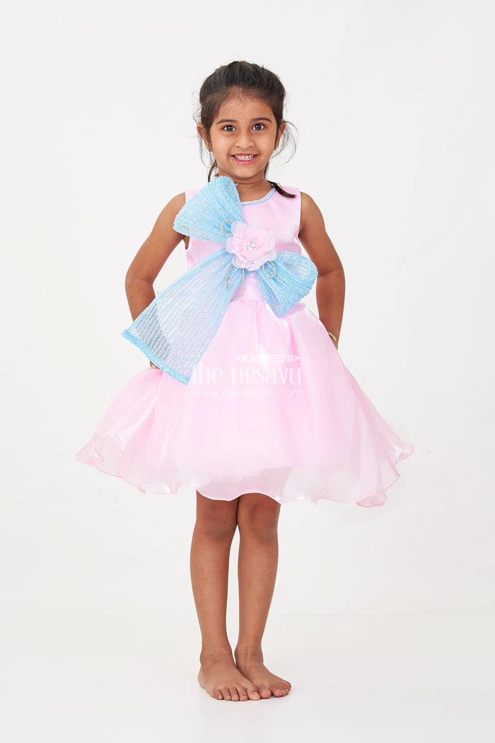 The Nesavu Girls Fancy Party Frock Girls Pink Net Frock with Blue Glitter Bow and Floral Accent in Glazed Organza Fabric Nesavu Nesavu Girls Pink Net Frock Blue Glitter Bow Glazed Organza Party Wear