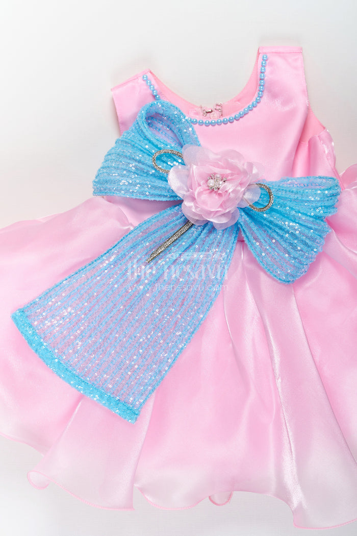 The Nesavu Girls Fancy Party Frock Girls Pink Net Frock with Blue Glitter Bow and Floral Accent in Glazed Organza Fabric Nesavu Nesavu Girls Pink Net Frock Blue Glitter Bow Glazed Organza Party Wear