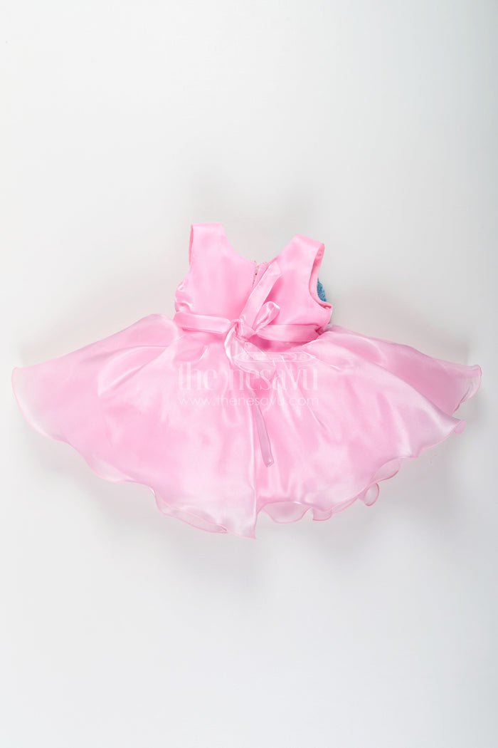 The Nesavu Girls Fancy Party Frock Girls Pink Net Frock with Blue Glitter Bow and Floral Accent in Glazed Organza Fabric Nesavu Nesavu Girls Pink Net Frock Blue Glitter Bow Glazed Organza Party Wear