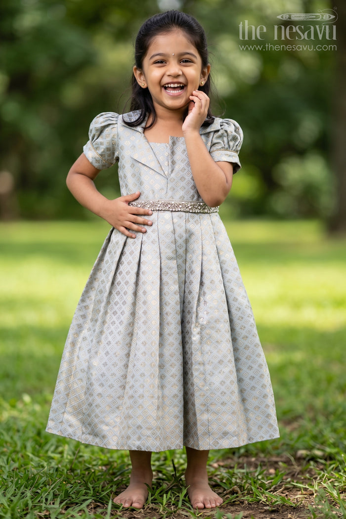 The Nesavu Girls Silk Gown Girls Semi Banaras Silk Gown with Collar Ethnic Grey and Gold Party Wear Nesavu 18 (2Y) / Gray GA343A-18 Nesavu Semi Banaras Silk Gown Girls Grey Ethnic Party Wear Dress Collar Puff Sleeves