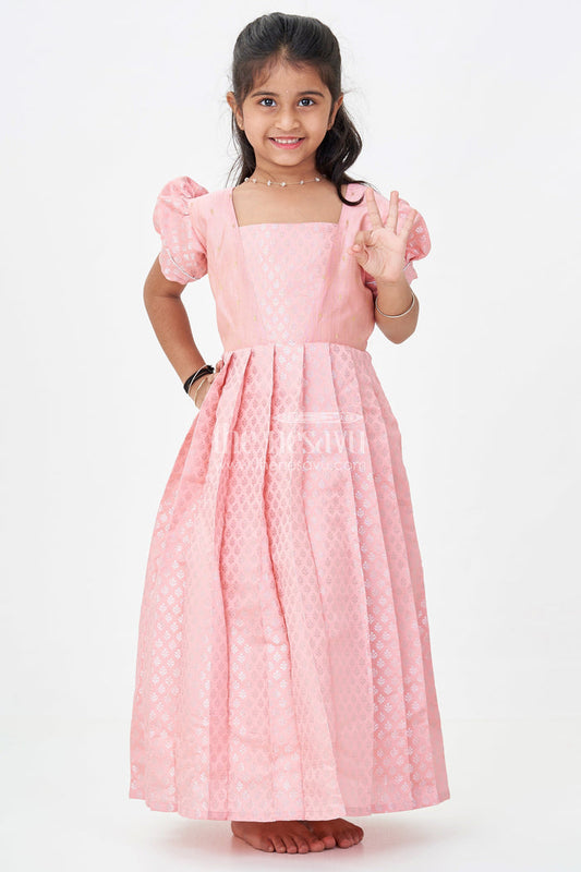 The Nesavu Girls Silk Gown Girls Semi Banaras Silk Pink Party Wear Gown with Intricate Woven Motifs and Classic Puff Sleeves Nesavu Girls Semi Banaras Silk Pink Party Wear Gown Floral Woven Design Puff Sleeves | The Nesavu