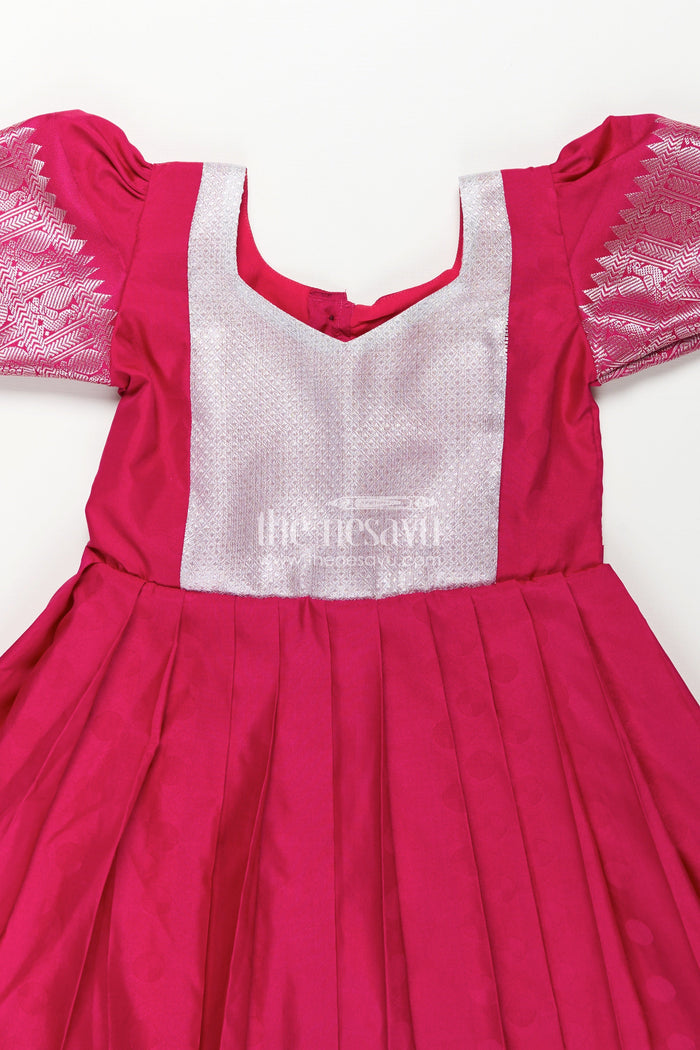 The Nesavu Girls Silk Gown Girls Semi Silk Pink Gown Design with Embellished Yoke and Traditional Zari Border Nesavu Girls Semi Silk Pink Gown Design Silver Yoke Puff Sleeves Traditional Festivities | The Nesavu