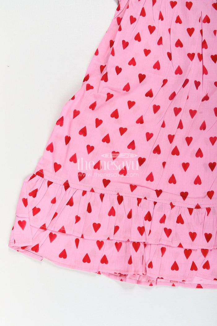The Nesavu Girls Cotton Frock Girls Single Piece Frock in Pink Cotton with Red Heart Digital Print and Ruffled Finish Nesavu Nesavu Girls Pink Cotton Single Piece Frock Red Heart Print Ruffle Hem Detailing