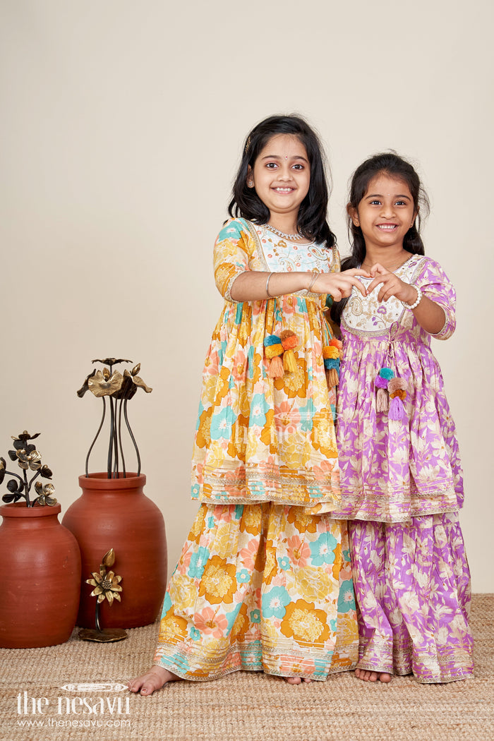 The Nesavu Girls yellow cotton sharara set with tassels and floral block print for ethnic days Nesavu Nesavu girls yellow cotton block print sharara set tassels  ethnic outfit school casual celebrations