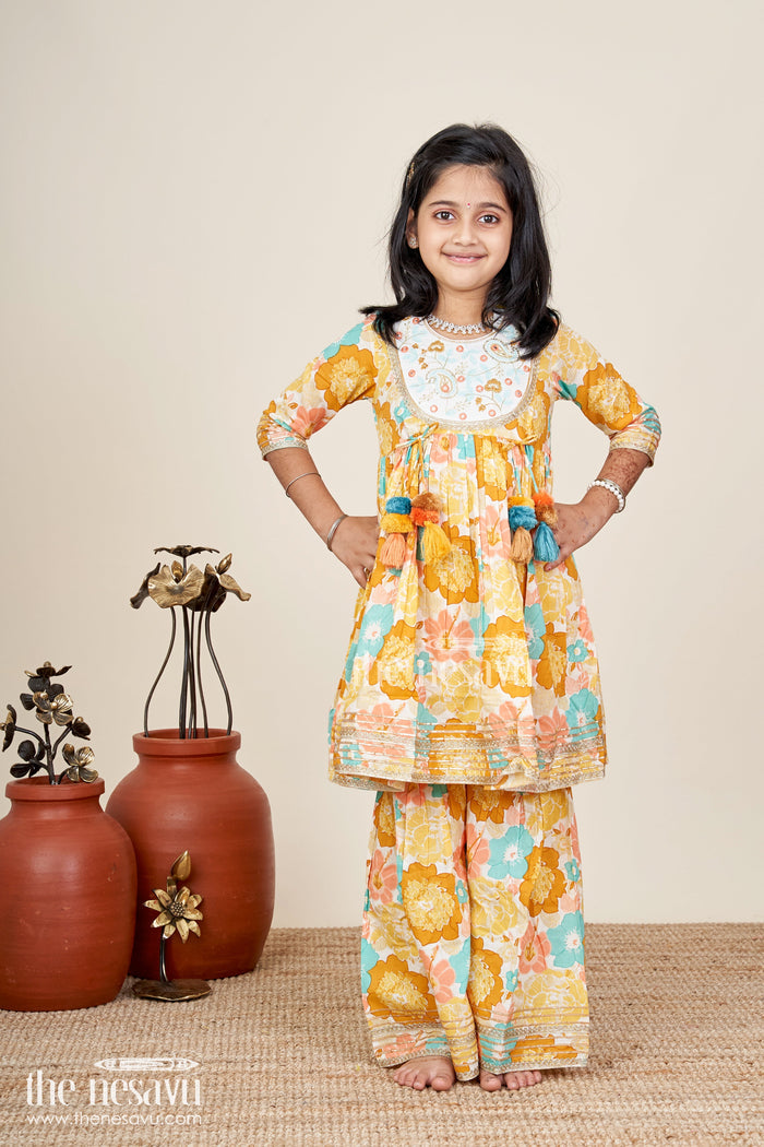 The Nesavu Girls yellow cotton sharara set with tassels and floral block print for ethnic days Nesavu Nesavu girls yellow cotton block print sharara set tassels  ethnic outfit school casual celebrations