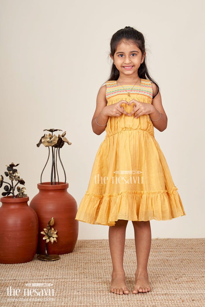 The Nesavu Girls Cotton Frock Girls Yellow Frocks Design with Popcorn Crush Cotton and Multicolor Embroidered Details Nesavu Nesavu Yellow Frocks Design Girls Thread Embroidery Soft Popcorn Crush Cotton Finish