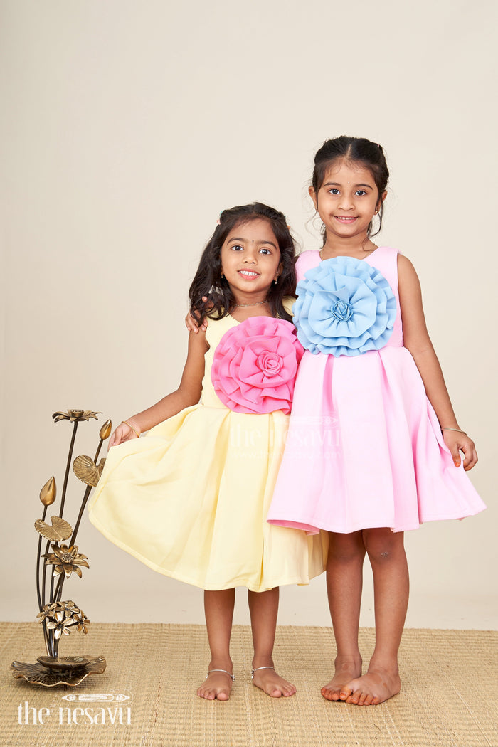 The Nesavu Girls Fancy Party Frock Girls yellow sleeveless party frock with oversized pink flower  birthday special Nesavu Nesavu girls yellow sleeveless party frock big pink flower  birthday celebration wear