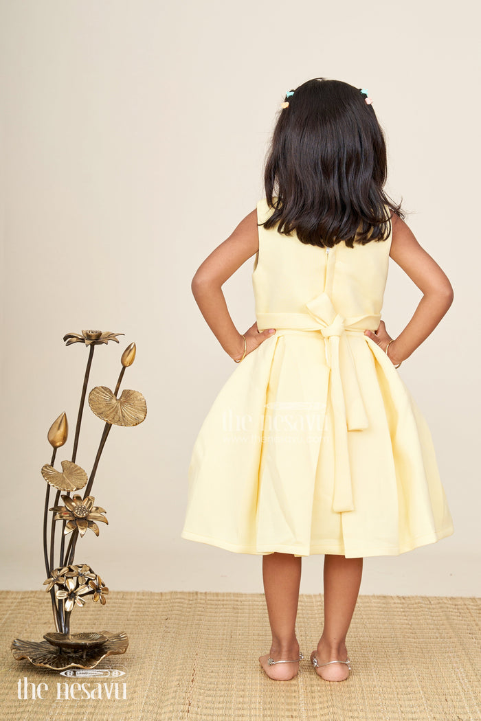 The Nesavu Girls Fancy Party Frock Girls yellow sleeveless party frock with oversized pink flower  birthday special Nesavu Nesavu girls yellow sleeveless party frock big pink flower  birthday celebration wear