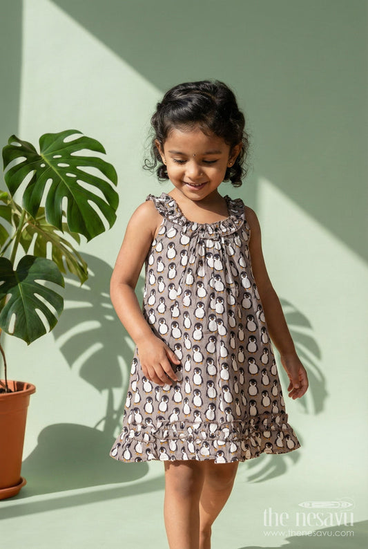 The Nesavu Girls Cotton Frock Kids Casual Cotton Printed Frock for Girls with Brown Penguin Block Print and Frilled Shoulders Nesavu 18 (2Y) / Black GFC1796B-18 Nesavu Brown Hand Block Kids Casual Cotton Printed Frock Penguin Motifs Ruffled Design