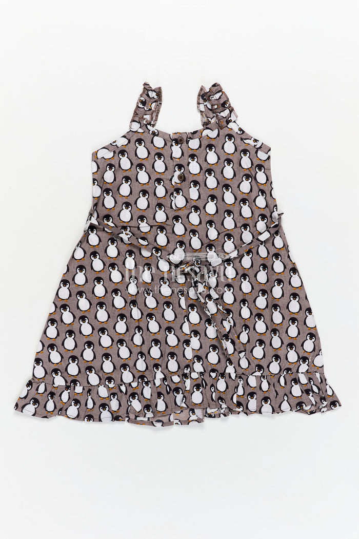 The Nesavu Girls Cotton Frock Kids Casual Cotton Printed Frock for Girls with Brown Penguin Block Print and Frilled Shoulders Nesavu Nesavu Brown Hand Block Kids Casual Cotton Printed Frock Penguin Motifs Ruffled Design