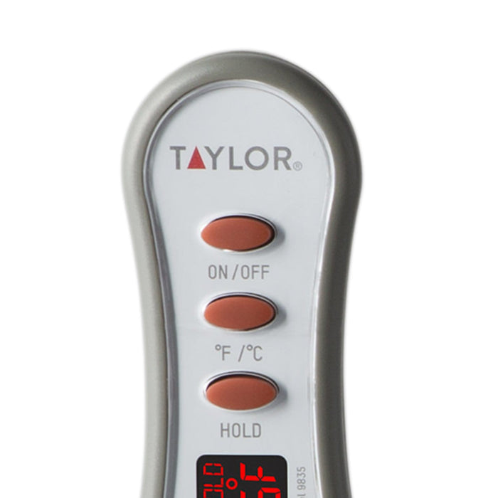 LED readout thermometer with round display showing 72.0°F on a wooden surface with parsley nearby.