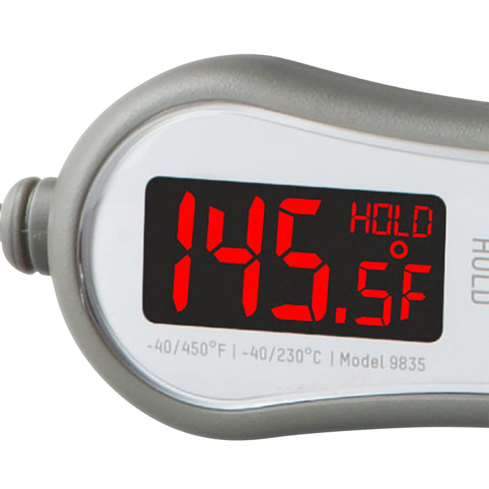 Close up of a silver LED readout thermometer with red digital display showing temperature and HOLD indicator