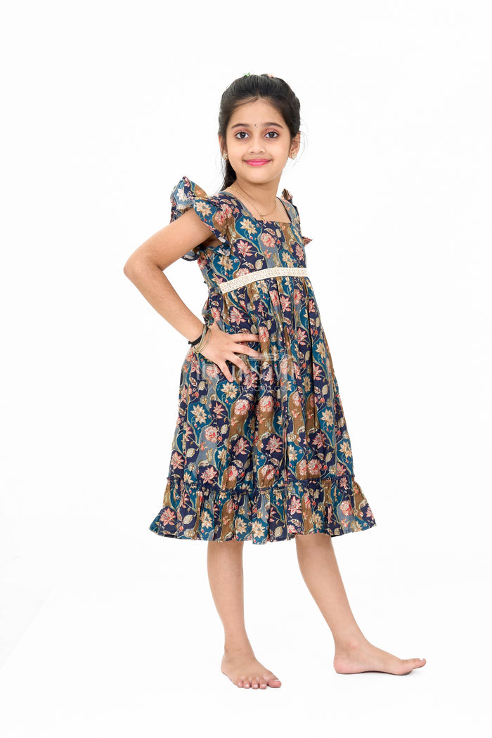 The Nesavu Girls Cotton Frock Long Party Wear Gown for Girls with Elegant Black Floral Print and Ruffle Details Nesavu Nesavu Long Party Wear Gown Girls Black Floral Print Ruffles