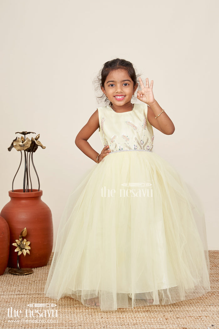 The Nesavu Girls Party Gown Satin and net party gown for girls with bead embroidery Nesavu Nesavu girls yellow party gown with satin bodice and embroidered net flare