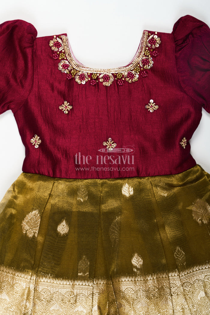 The Nesavu Silk Party Frock Silk Frocks for Girls with Maroon Embroidered Yoke and Gold Tissue Pleated Skirt for Festive Wear Nesavu Nesavu Silk Frocks for Girls with Maroon Embroidered Bodice and Gold Tissue Bottom for Festive Wear