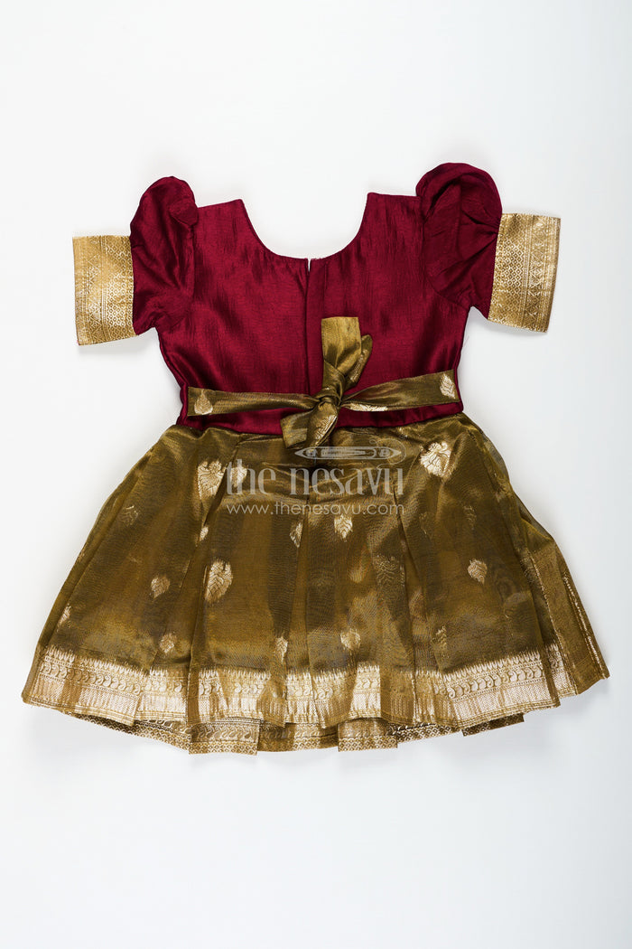 The Nesavu Silk Party Frock Silk Frocks for Girls with Maroon Embroidered Yoke and Gold Tissue Pleated Skirt for Festive Wear Nesavu Nesavu Silk Frocks for Girls with Maroon Embroidered Bodice and Gold Tissue Bottom for Festive Wear