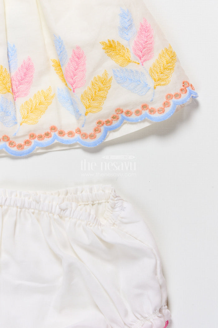 The Nesavu Baby Frocks Sleeveless Baby Frock with Floral Embroidery and Pastel Feather Design Nesavu Nesavu cream embroidered sleeveless baby frock with pastel leaf design