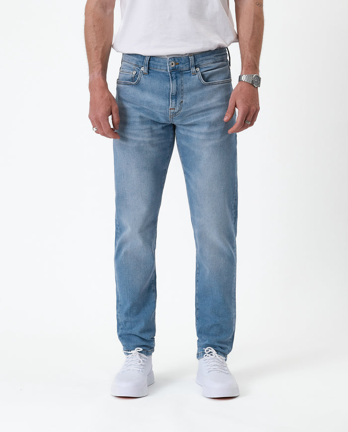 The Jeans Slim Fit in light midwash — front view against a white background