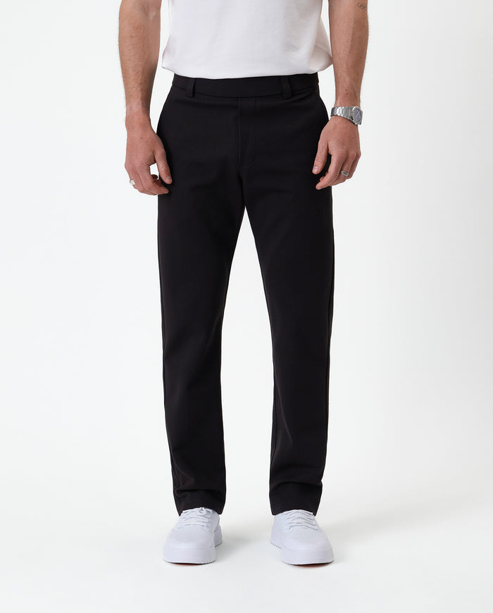 The Proper Pant Regular Fit in black — front view showing the clean straight leg silhouette