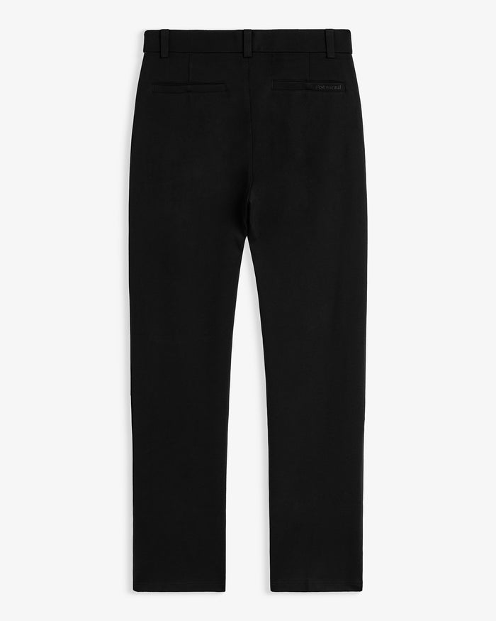 The Proper Pant Classic Straight Fit in black — back view showing the pockets and C'est normal logo
