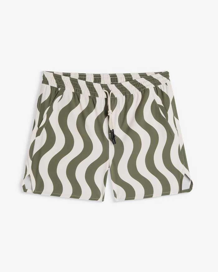 A front view of The Shorts in an olive curl stripe pattern, laid flat on a white background. The image highlights the wavy design, elasticated waistband with a drawstring, and notched hem.