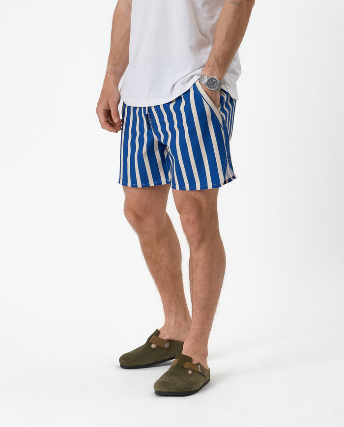 The Shorts in nautical stripe — worn with a white t-shirt and green suede clogs
