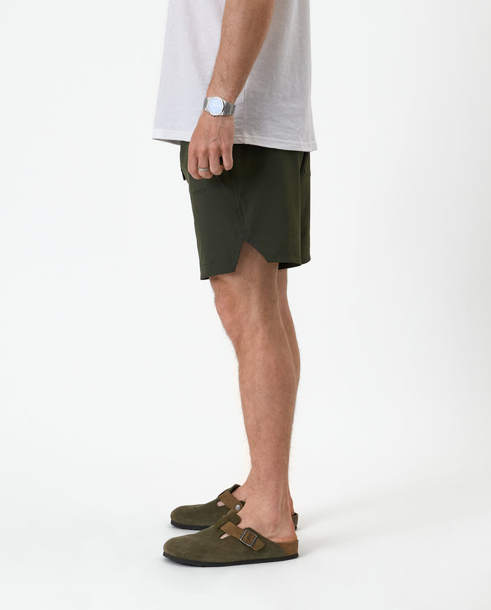 The Shorts in khaki — side view showing the notched hem and athletic fit