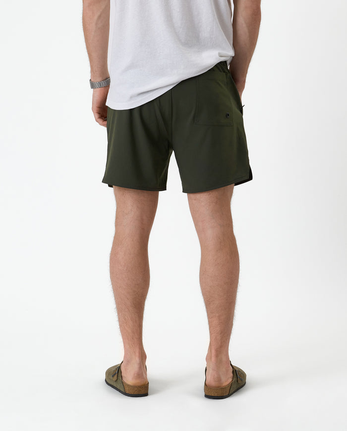 The Shorts in khaki — back view showing the pocket detail and notched hem