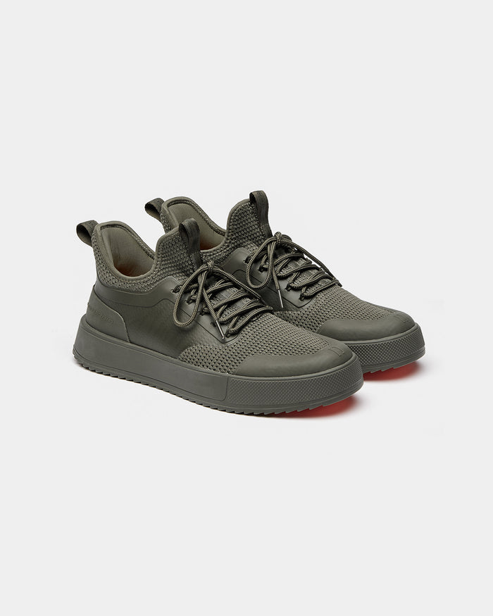 The Sneakers 2.0 in khaki — side view showing the mesh upper and rubber accents